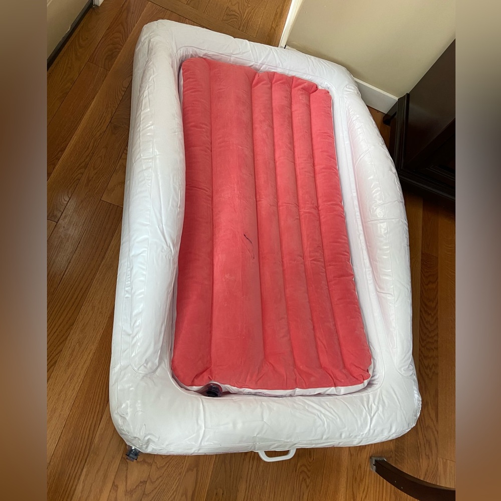 Inflatable Kids Travel Bed Toddler Air Mattress with safety bumpers.